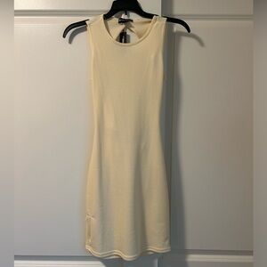 PrettyLittleThing pale yellow mini dress with an open back.